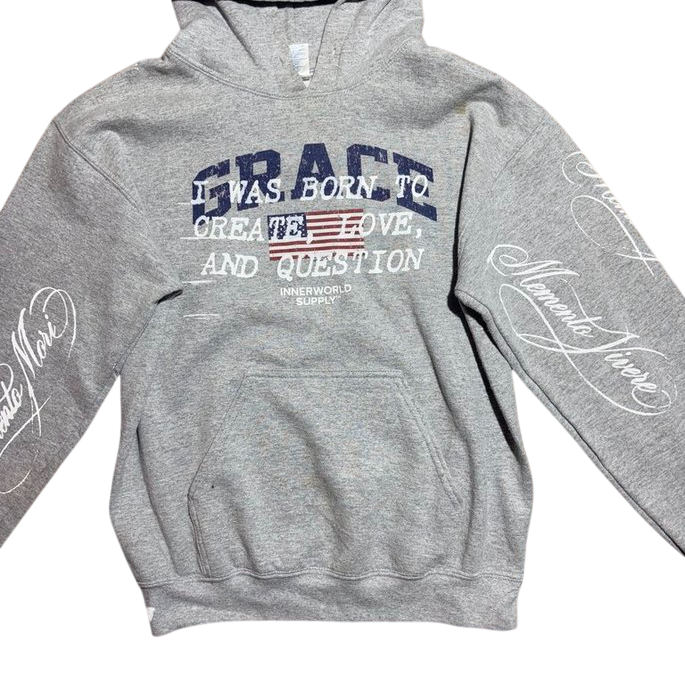 Grey pullover hoodie with Grace flag chest graphic and Memento Mori / Memento Vivere sleeve script