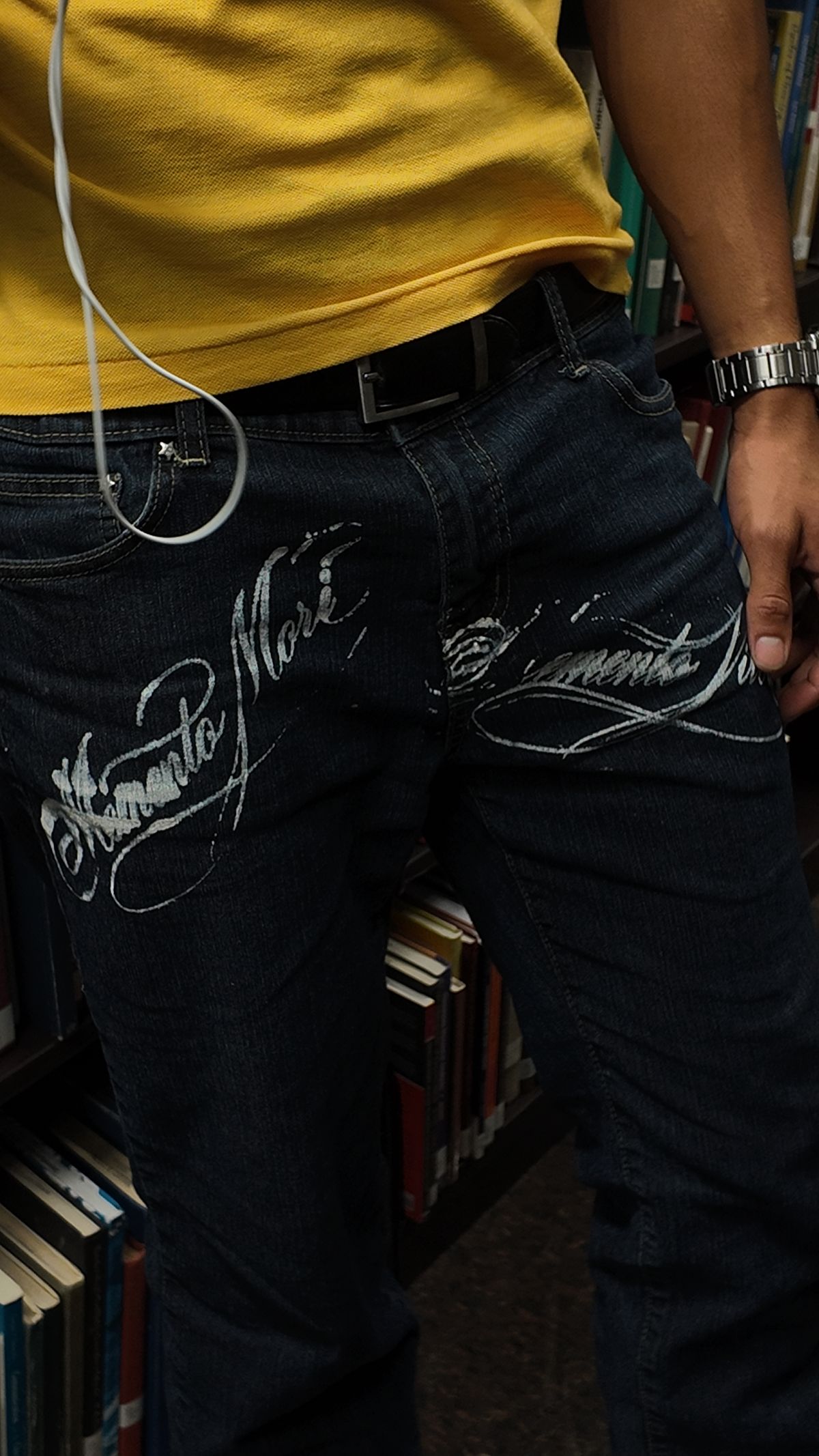 Memento Mori / Memento Vivere hand-pulled across dark denim jeans